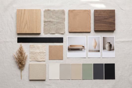 A flat-lay Japandi interior design mood board with wood, linen, plaster, paint chips and furniture photos